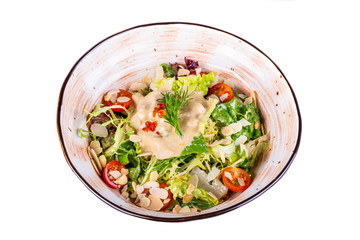 Vegetable salad with cream sauce and red caviar