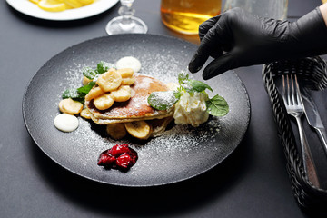 Cooking. The chef decorates the plate. Serving and decorating the dish.