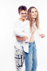 young pretty couple together posing cheerful isolated on white background, lifestyle people concept, happy boy and girl