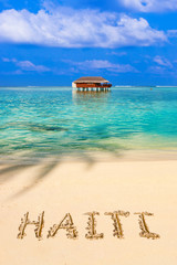 Fototapeta premium Word Haiti on beach