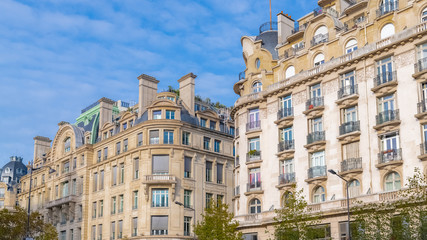 Fototapeta na wymiar Paris, charming street and buildings, typical parisian facades in the Marais 