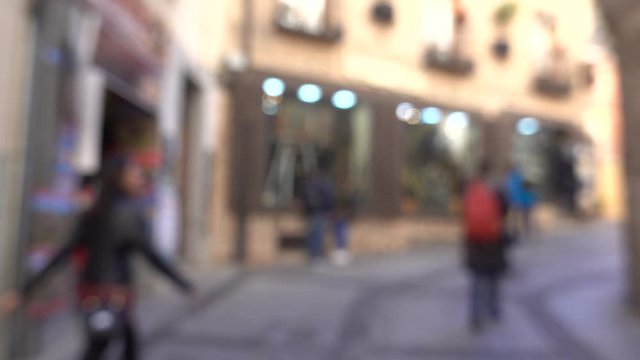 Blurred defocused abstract on street with a shop background view of Madrid in spain