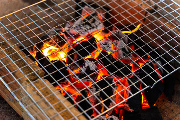 Charcoal is on fire, used in cooking