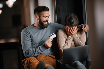 Young happy couple. Couple shopping online. 