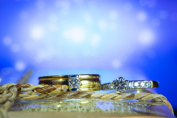 Wedding ring with blue background
