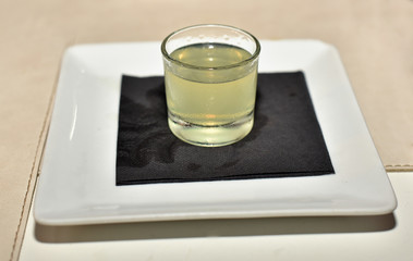 Shot of limoncello close up. Traditional italian liqueur