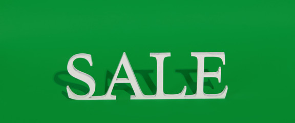 Green Friday concept. Wooden symbol word with text Sale on green backround. Shopping concept