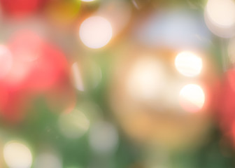 Christmas tree bokeh blur abstract background for merry x'mas party and new year celebration in red green gold color for xmas holiday night light 