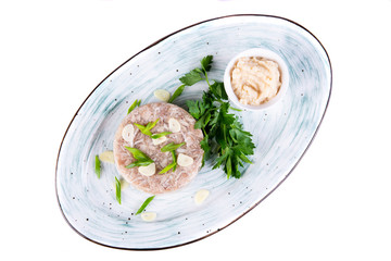 Pour meat with garlic and green onions on a plate
