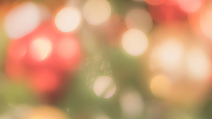 Christmas tree bokeh blur abstract background for merry x'mas party and new year celebration in red green gold color for xmas holiday night light 