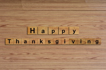 Happy Thanksgiving written on wood cubes. message text on wooden table for backdrop design.