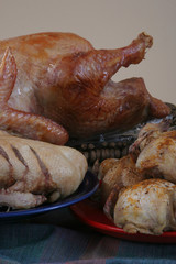 Roasted Chicken, Duck and Turkey On The Dinner Table