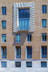 Facade of a building in Piazza S.Babila, Milan, Italy