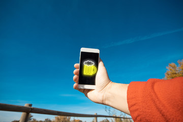 man with mobile phone with beer mug symbol