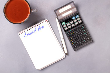 Desktop with business charts, calculator and money. 52-week savings plan. Financial planner.