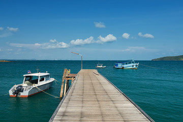 Fototapeta na wymiar seasacape with bridge and boats in summer