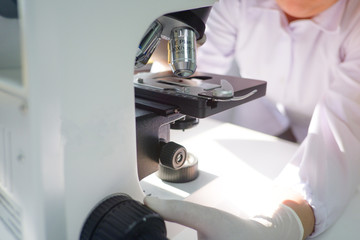 Cropped shot view of  the equipment and science experiments in Laboratory, Chemical substances for research and analyzing a sample under the microscope in laboratory.   