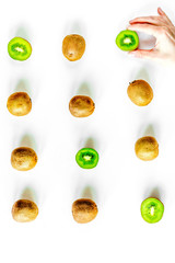 exotic fruit pattern with sliced kiwi on white table background top view