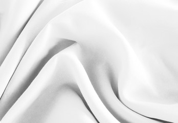 Fototapeta na wymiar Closeup of rippled white silk fabric background
