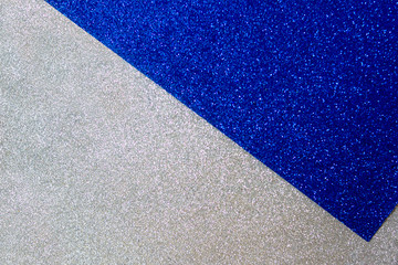 Fototapeta premium A brilliant background consisting of two colors of blue and silver. Bright christmas template for design.