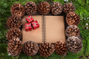 Christmas pine cone garland on the wooden rustic table