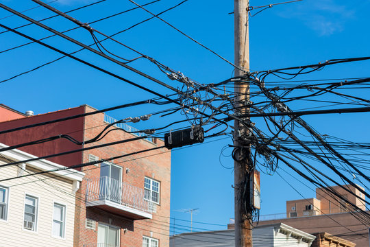 Telephone Lines and Pole in front of Residential Buildings and Homes in Astoria Queens New York