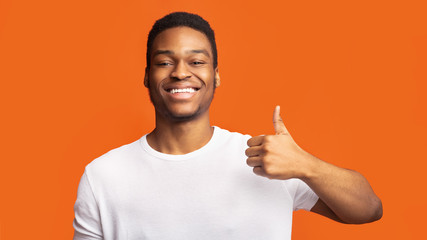 Black guy showing thumb up and smiling