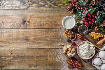 Christmas baking background. Ingredients for cooking xmas baking. Flour, eggs, sugar, berry, spices...