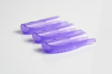 Three pen caps on white background.