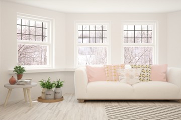 Stylish room in white color with sofa and winter landscape in window. Scandinavian interior design. Hight resolution image. 3D illustration
