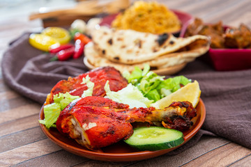 Traditional Indian food chicken tandoori and Tikka with garlic naan