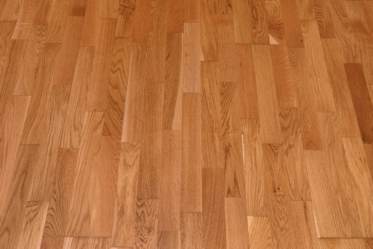 Brown laminate floor texture background. natural wooden polished surface parquet
