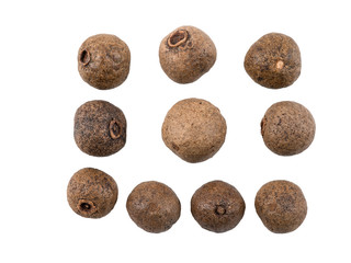 Some black peppercorns isolated on white background with copy space for text or images. Spices and herbs. Packaging concept. Close-up, side view.