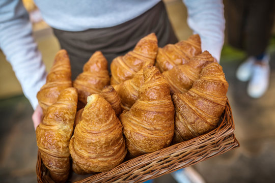 Top view of delicious just baked croissants lying in box