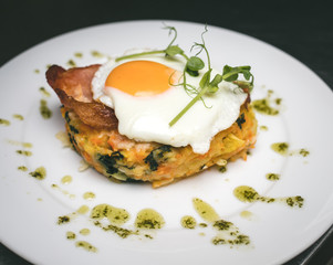 fried egg on plate with salad