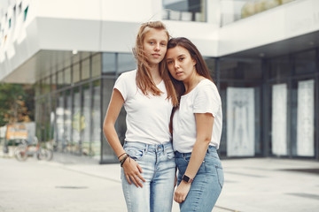 Women in a autumn park. Girl in a white t-shirts.