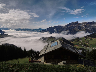 Obraz premium Views of the cloudy valley from the Col des Mosses in the Bernese Alps of Switzerland