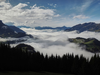 Views of the cloudy valley from the Col des Mosses in the Bernese Alps of Switzerland