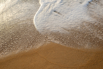 Sea waves on the beach, beautiful soft foam