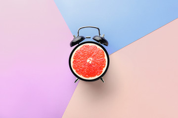 Alarm clock on color background