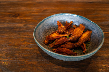 Fried Chicken in Fish Sauce on wooden table.