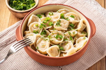 Meat filled dumplings, pelmeni, Russian cuisine.