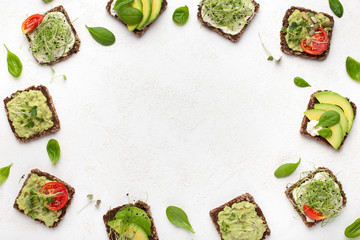 Rye bread sandwiches with tofu, avocado and microgreen