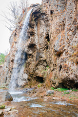 Autumn landscape with a river and rocky terrain