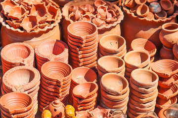 Bunch Group or Stack of Hand Made Orange Colored Simple Earthen Lamps for Deepawali Diwali