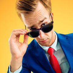 Are you seriously?! Funny skeptic businessman in corporate style blue suit and red tie, looking...