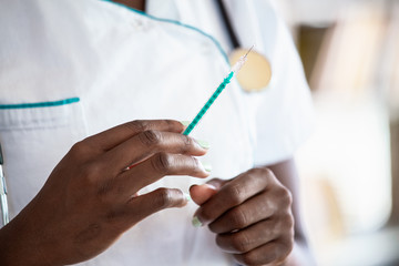 Syringe, medical injection in hand, palm or fingers. Medicine plastic vaccination equipment with needle. Nurse or doctor. Liquid drug or narcotic. Health care in hospital.