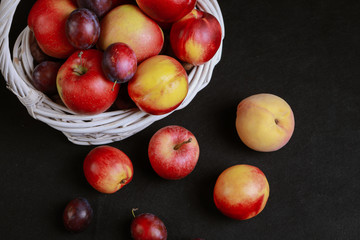 full basket of apples on a black background
