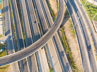 Transport junction freeway road with vehicle movement in morning rural of Thailand