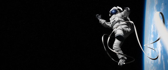 astronaut in orbit of planet Earth 